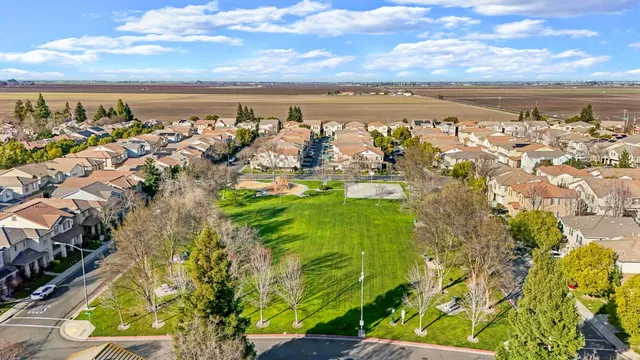an aerial view of residential houses with outdoor space