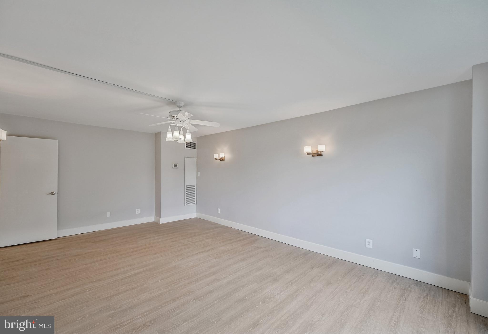 5101 River Road, Unit 618 Bethesda, MD 20816 - Photo 18 of 46 a view of an empty room with wooden floor