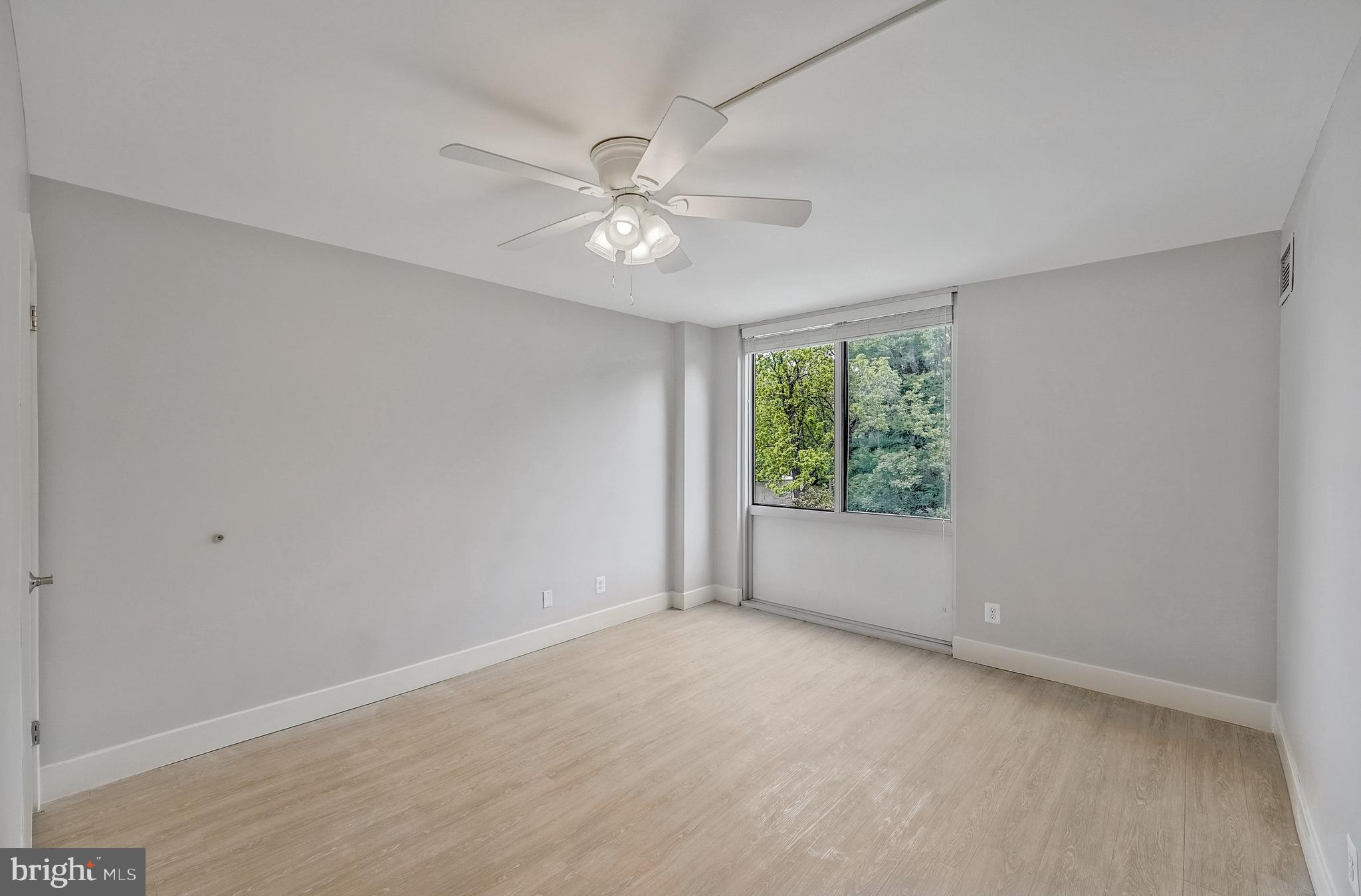 5101 River Road, Unit 618 Bethesda, MD 20816 - Photo 23 of 46 a view of an empty room with a window