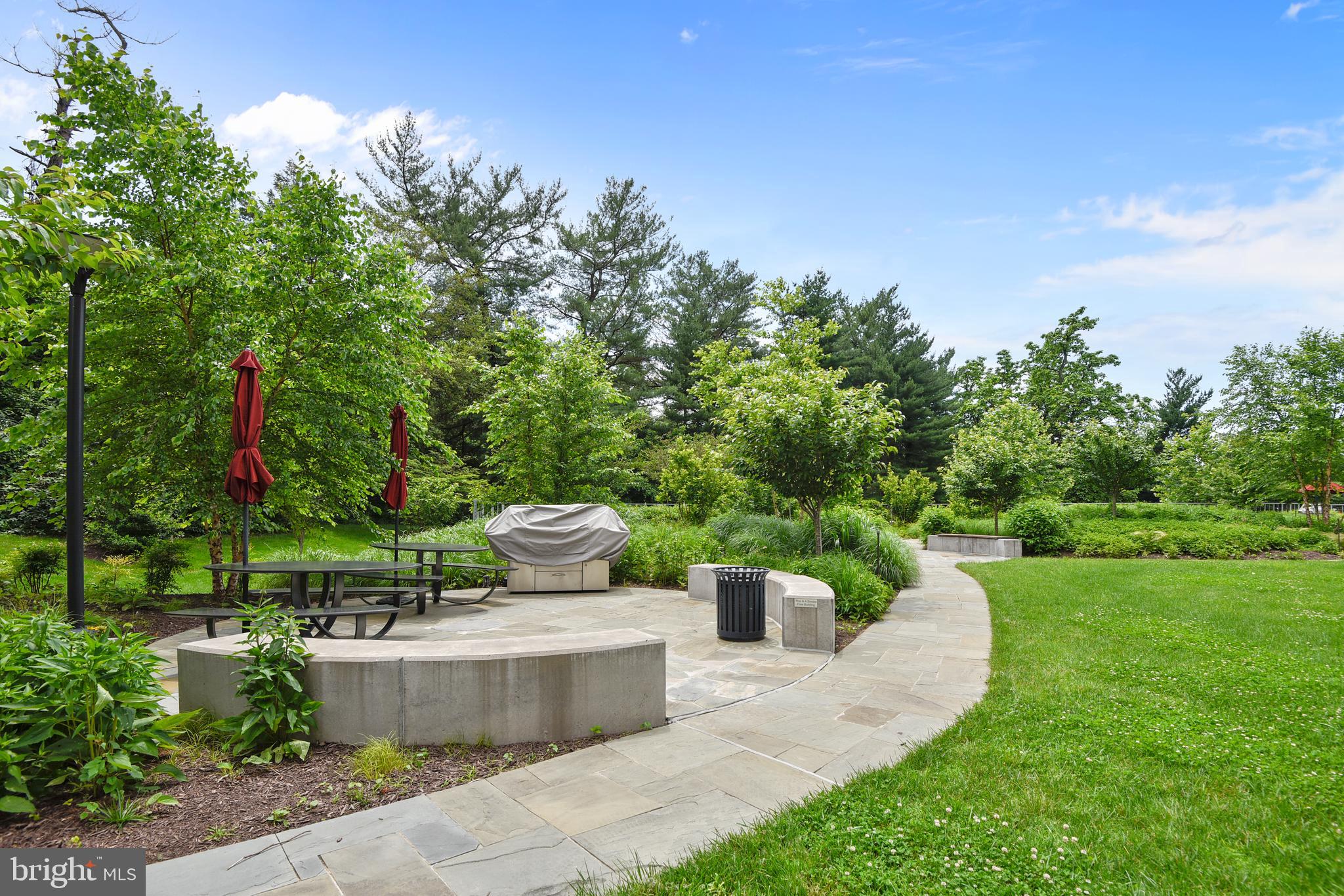 5101 River Road, Unit 618 Bethesda, MD 20816 - Photo 41 of 46 a view of a garden with fountain in front of the house