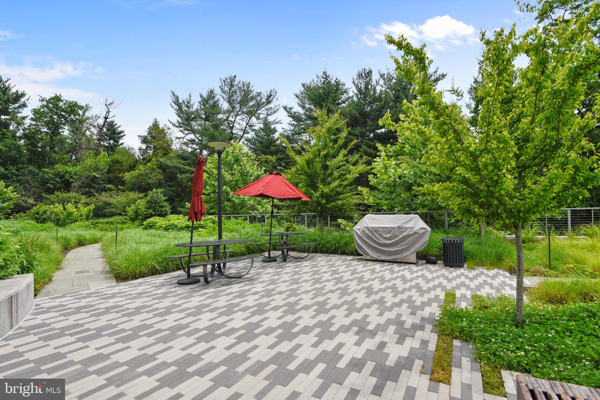 5101 River Road, Unit 618 Bethesda, MD 20816 - Photo 43 of 46 a view of a table and chairs in the garden