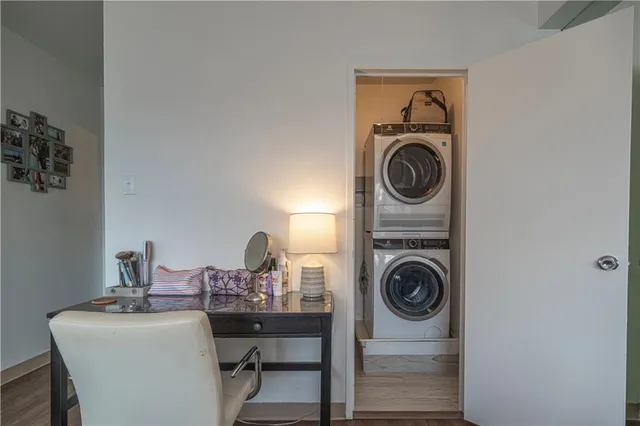a view of a dining room with a table and chairs