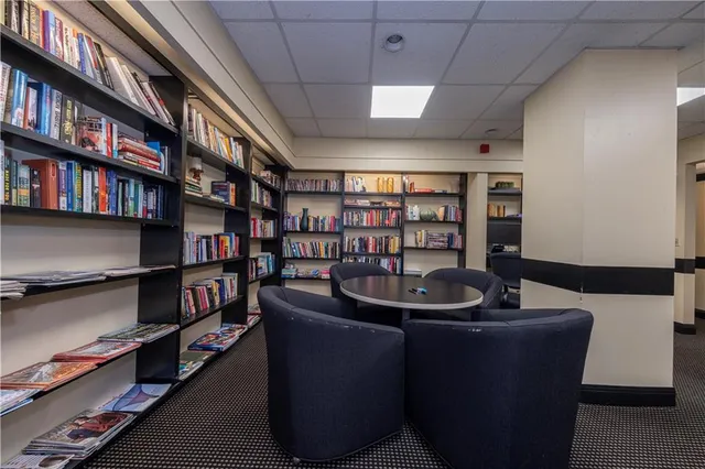 a kitchen with a sink a table and chairs