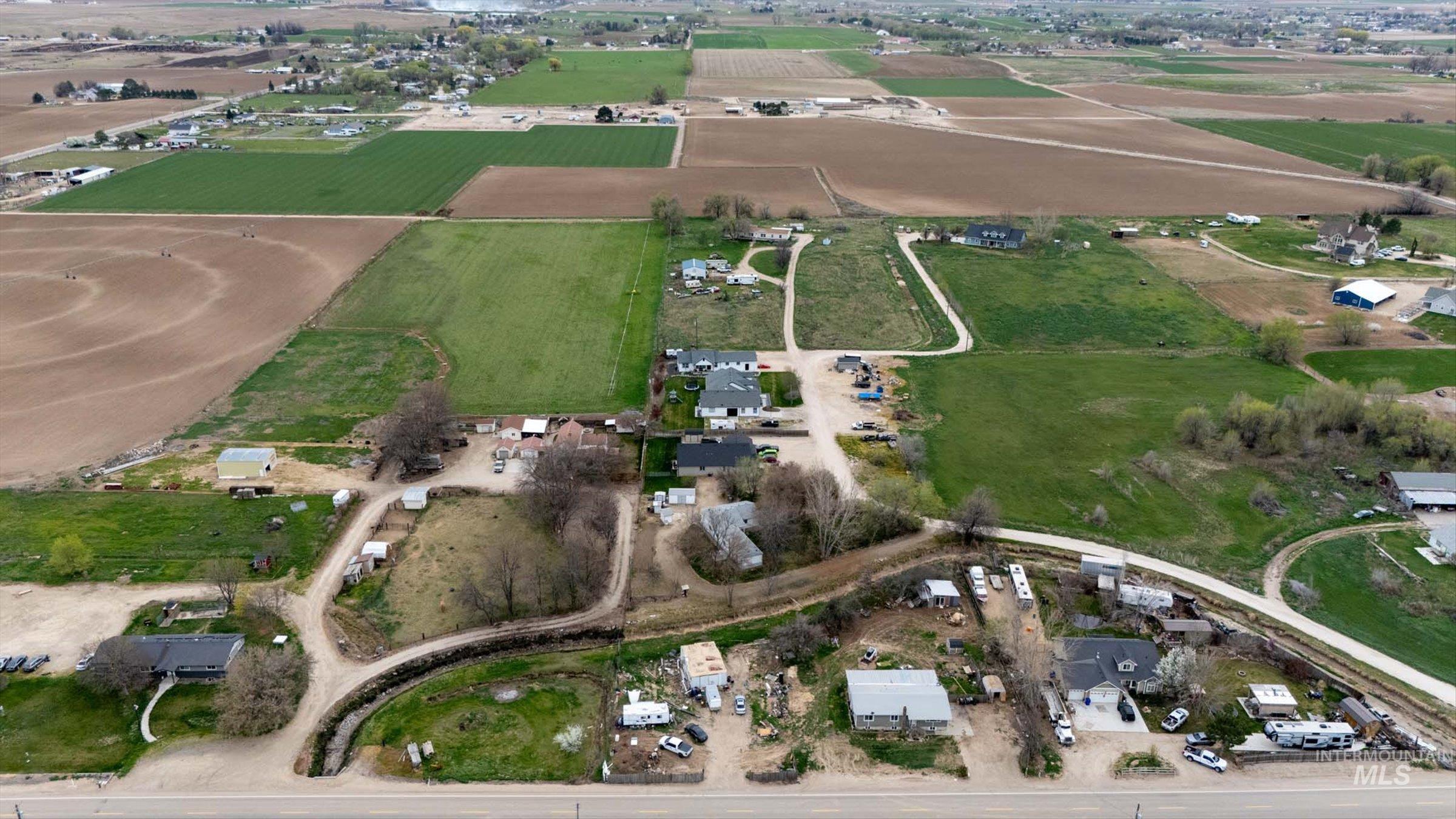 6267 Deer Flat Road Nampa, ID 83686 - Photo 17 of 50 Aerial view of property and surrounding area featuring rural landscape and extensive farmland