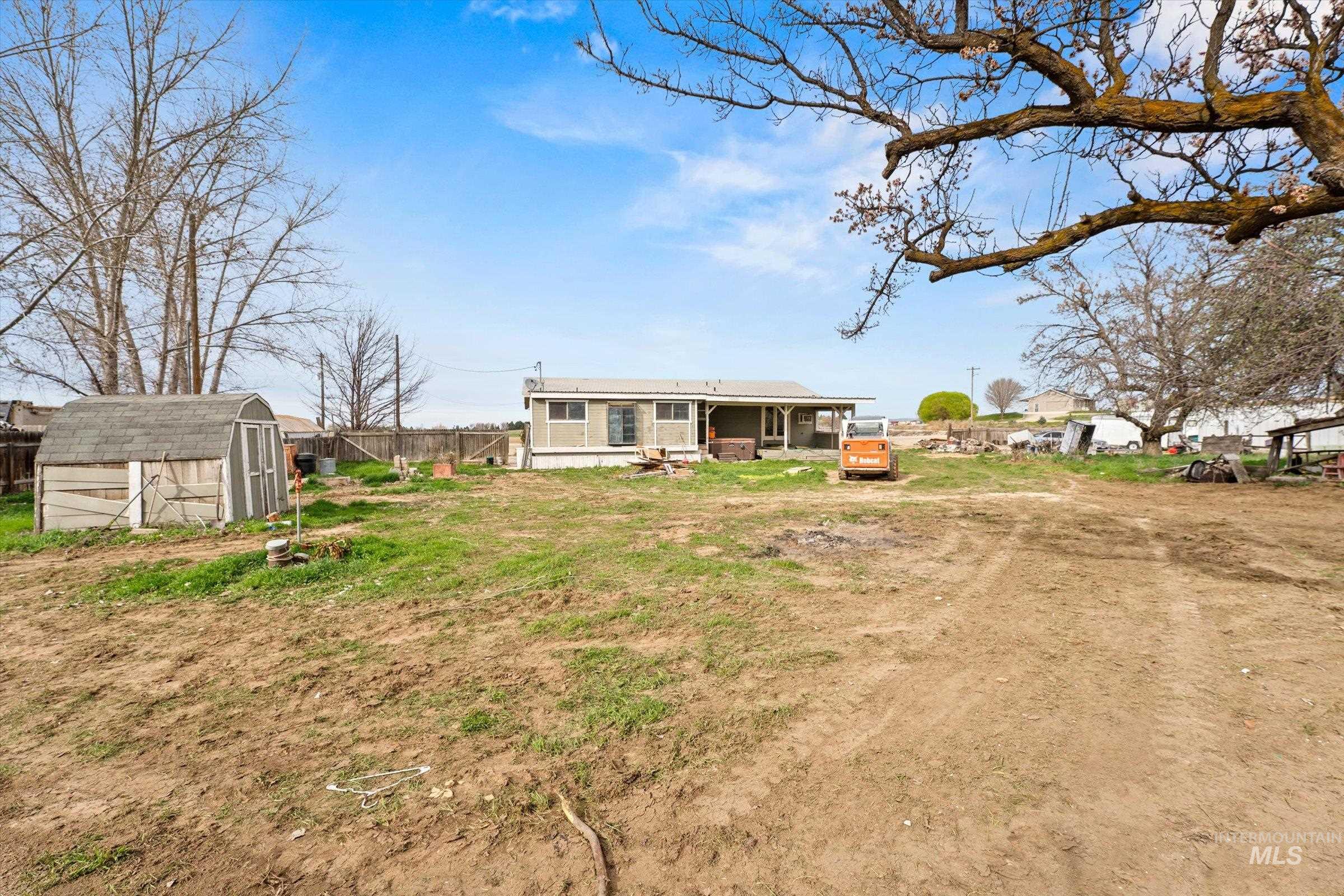 6267 Deer Flat Road Nampa, ID 83686 - Photo 34 of 50 Back of property with a storage unit