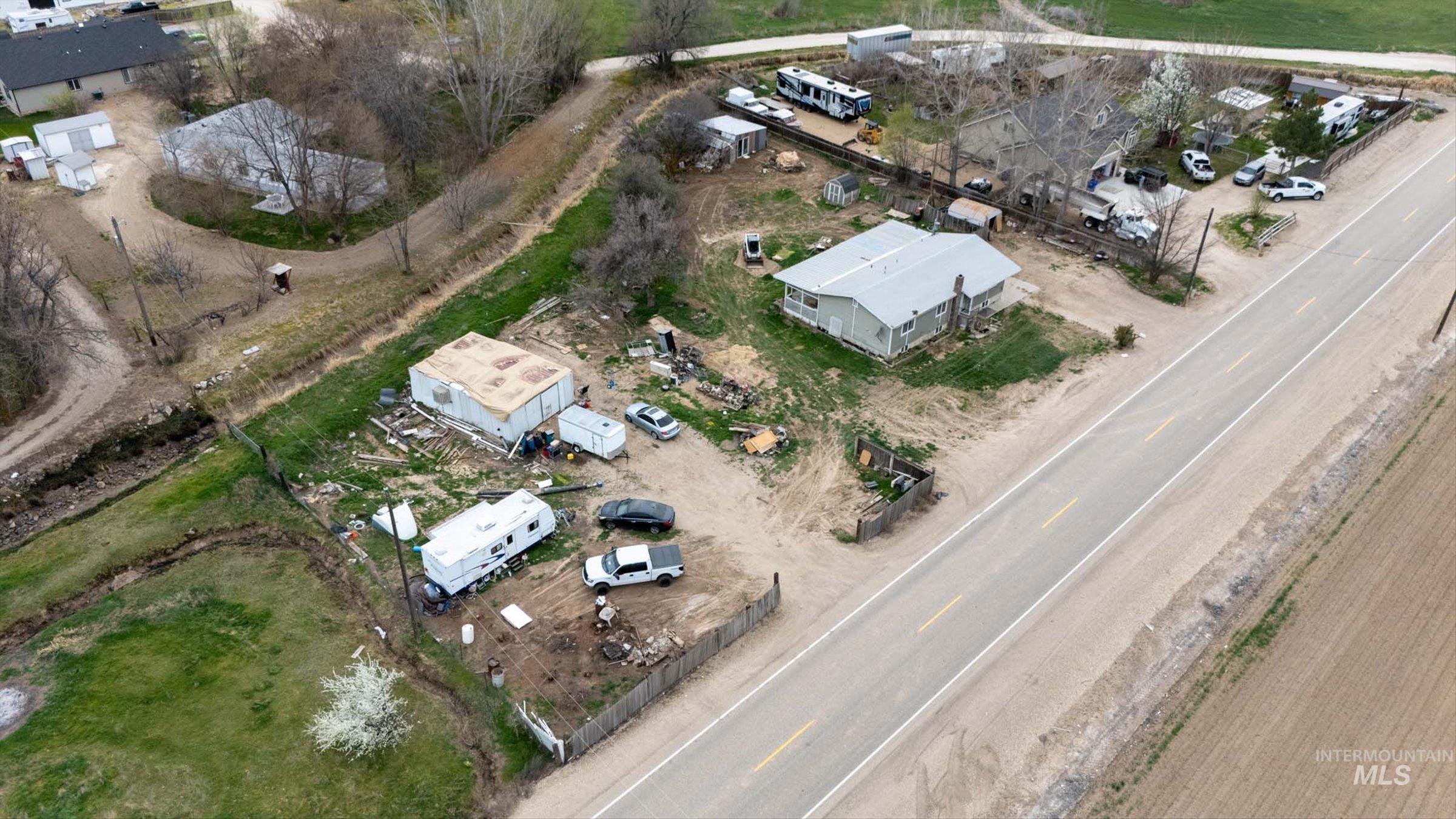 6267 Deer Flat Road Nampa, ID 83686 - Photo 44 of 50 Aerial view of property and surrounding area featuring nearby suburban area