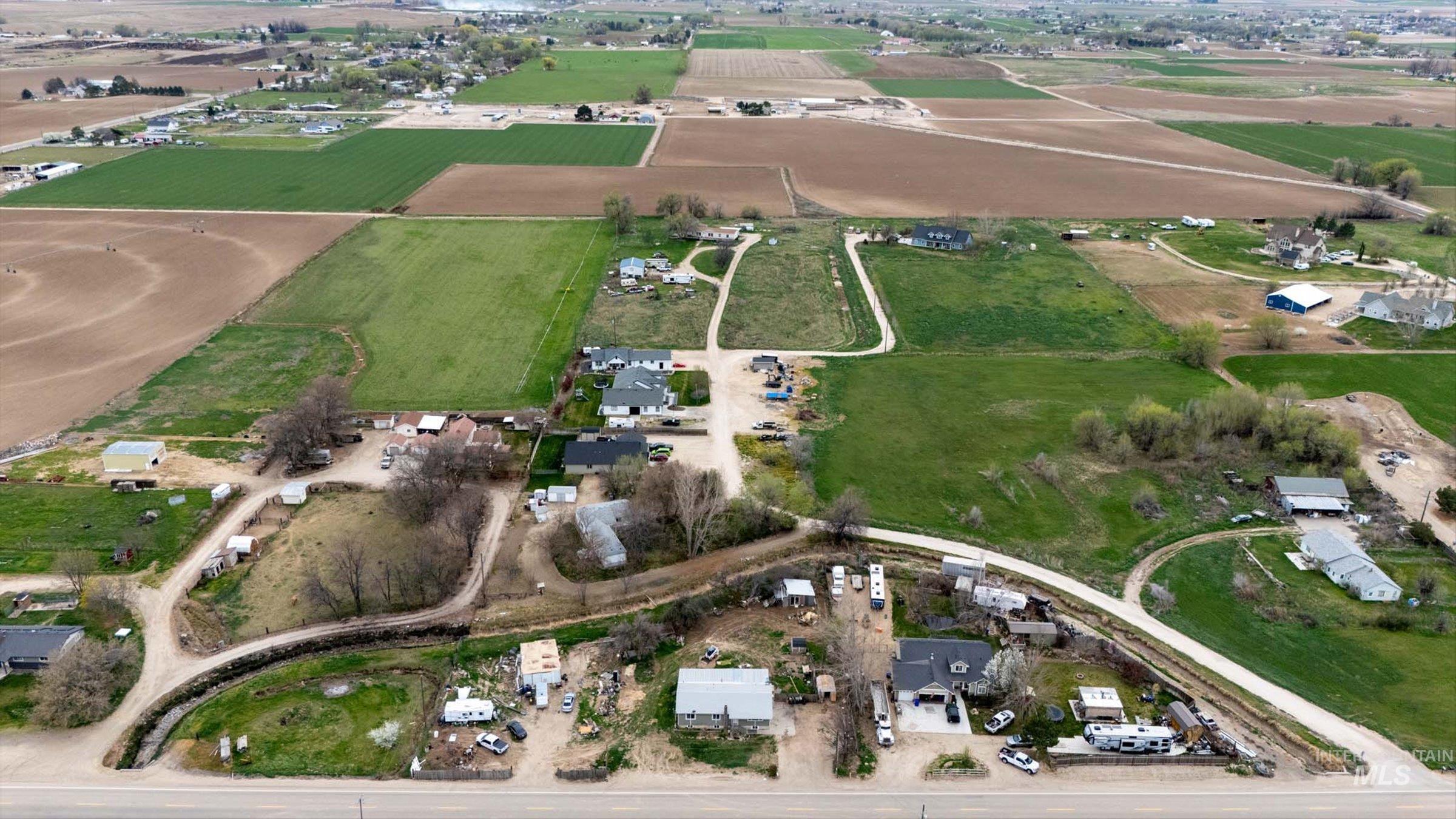6267 Deer Flat Road Nampa, ID 83686 - Photo 48 of 50 Aerial view of property's location featuring rows of crops and rural landscape
