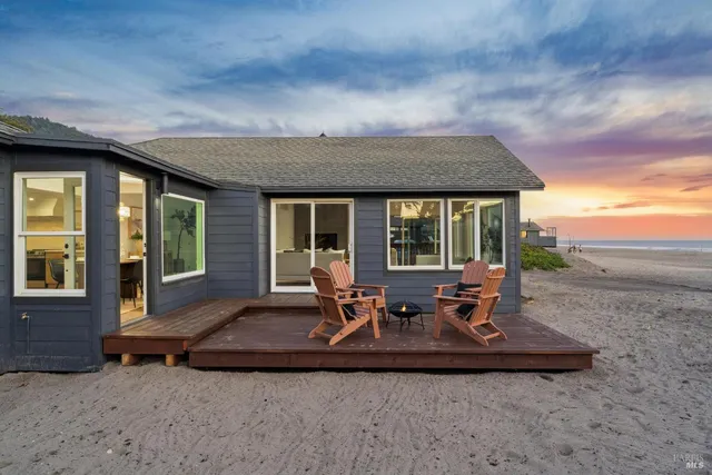a building outdoor space with patio furniture and potted plants