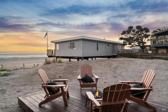 a view of house with backyard