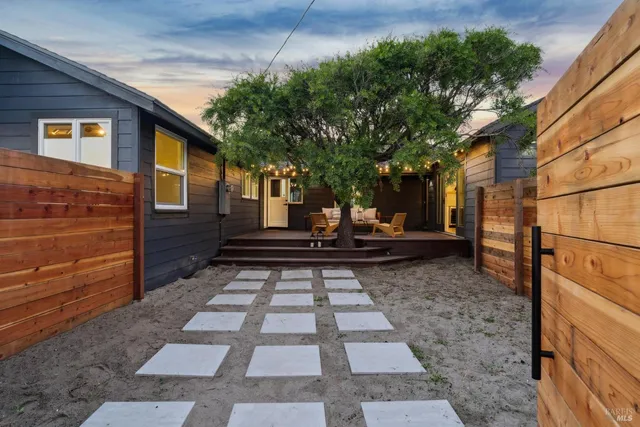 a backyard of a house with seating space