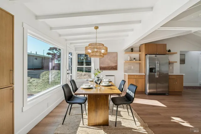 a view of a dining room with furniture window and outside view