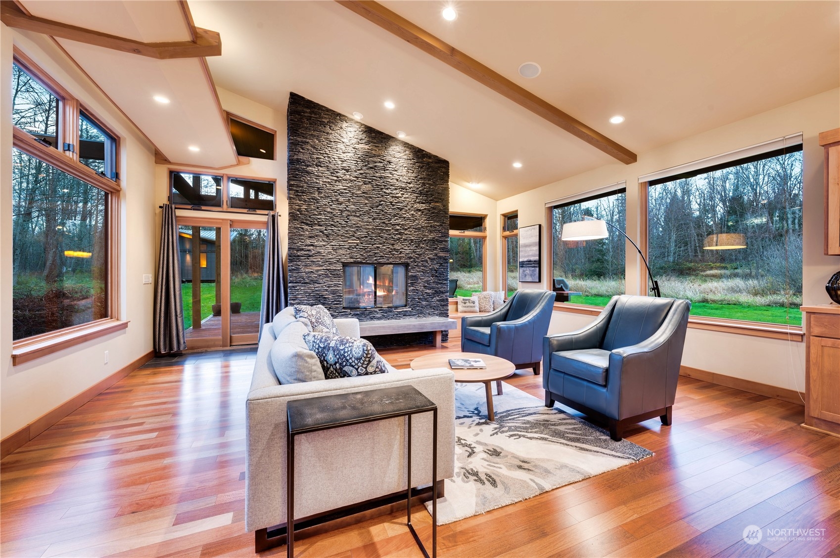 3410 Aldergrove Road Ferndale, WA 98248 - Photo 8 of 40 a living room with fireplace furniture and a large window