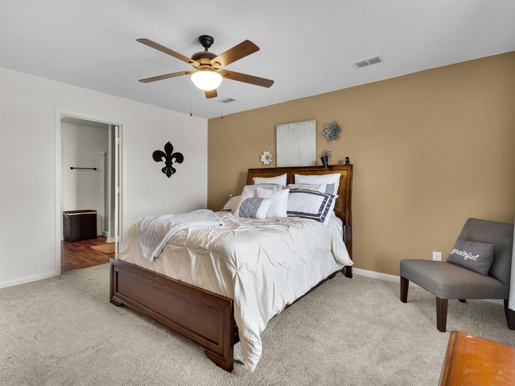 1808 Douglas Street Howe, TX 75459 - Photo 19 of 37 a bedroom with a bed and couch