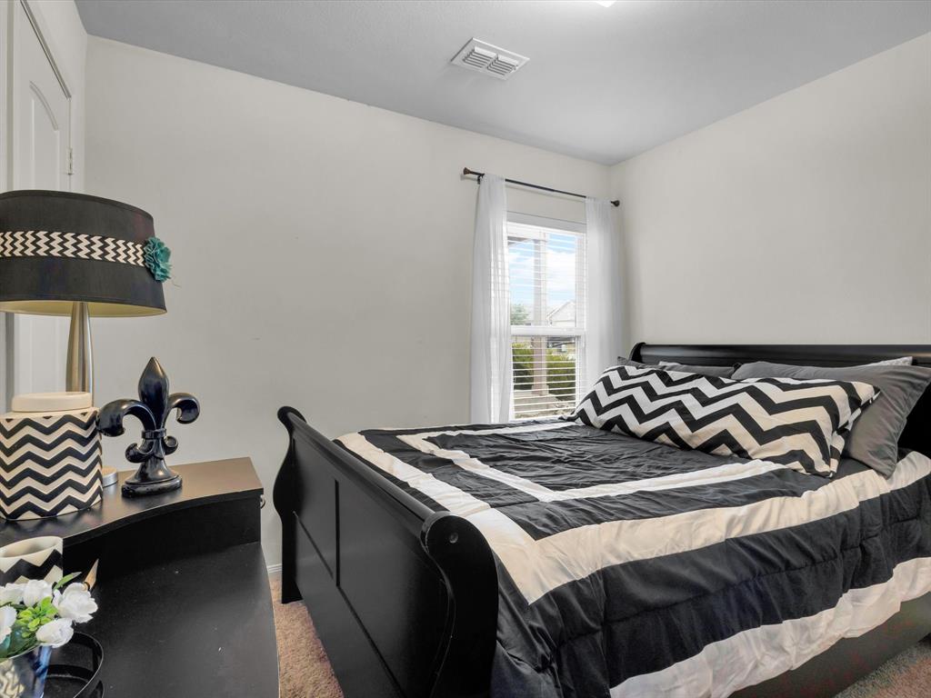 1808 Douglas Street Howe, TX 75459 - Photo 4 of 37 a bedroom with a bed and a window