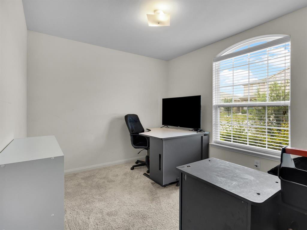 1808 Douglas Street Howe, TX 75459 - Photo 6 of 37 a view of a workspace with furniture and a window