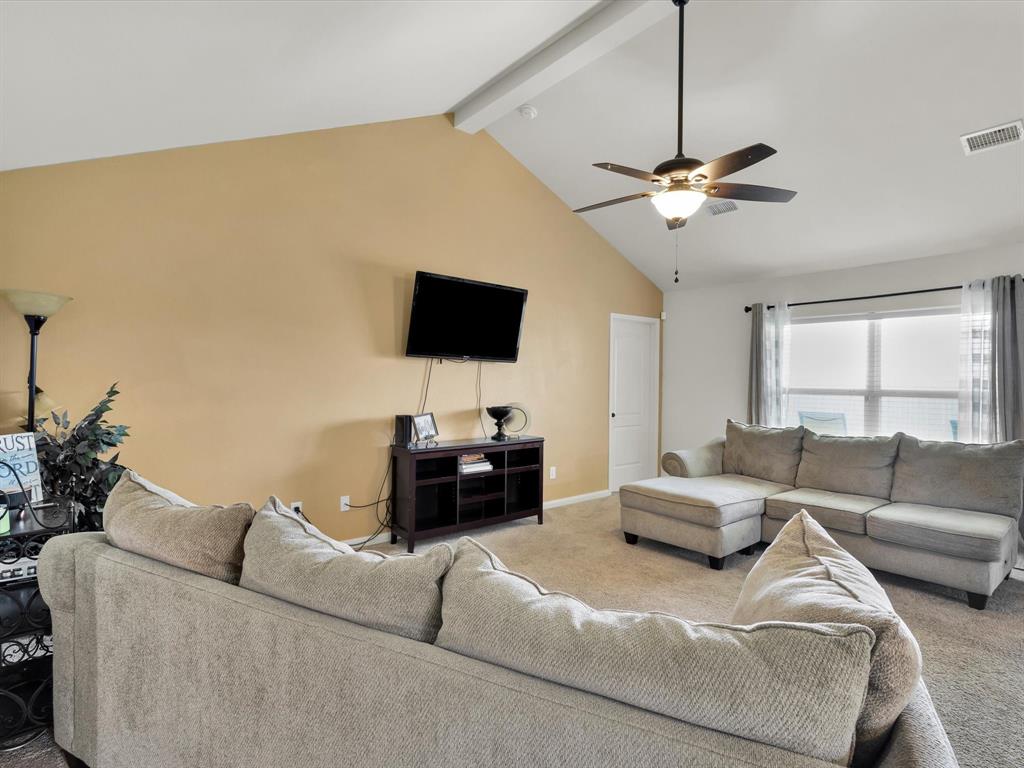 1808 Douglas Street Howe, TX 75459 - Photo 9 of 37 a living room with furniture and a flat screen tv