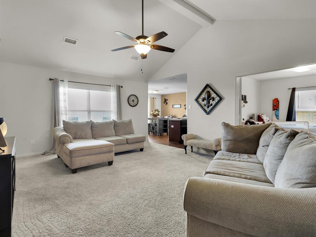 1808 Douglas Street Howe, TX 75459 - Photo 10 of 37 a living room with furniture and a chandelier