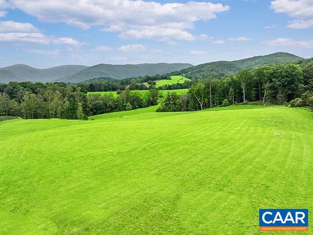 a view of a big yard with a large mountain
