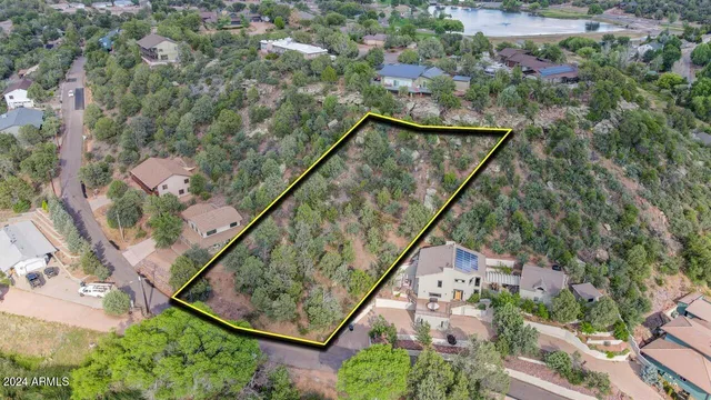 an aerial view of a house and mountain view