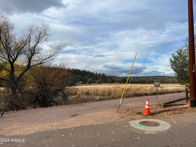 a backyard of a house with portable swimming pool table and chairs
