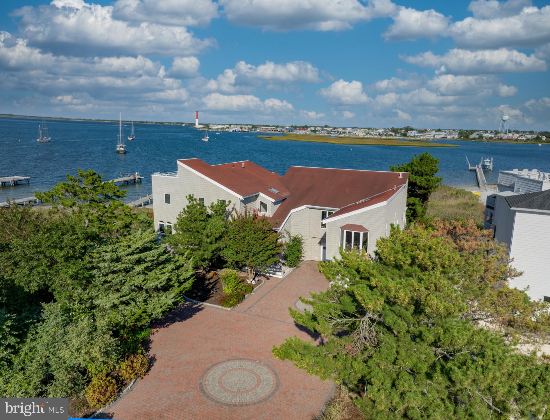 an aerial view of a house with yard
