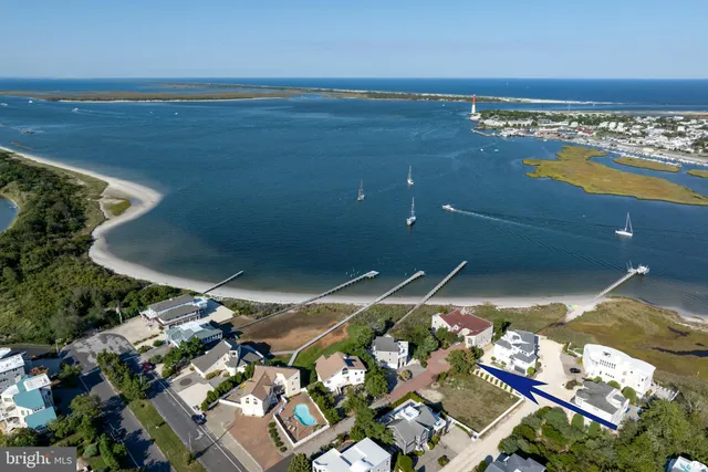an aerial view of a house with outdoor space pool seating area and yard