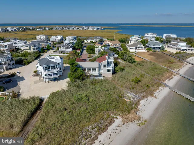 a dining room with furniture a chandelier and window