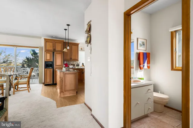 a view of a porch with chairs and table in a patio