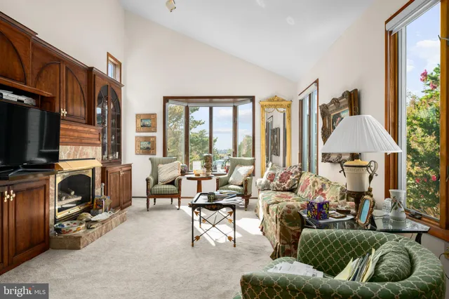 a view of a chairs and table in the balcony