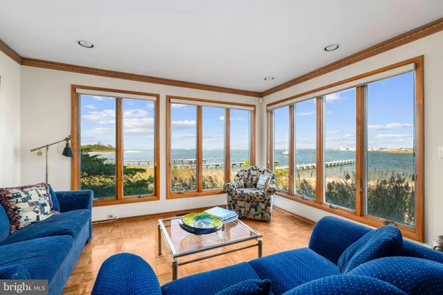 a bedroom with two beds and a window