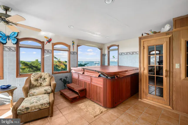 a view of an entryway with wooden floor and windows
