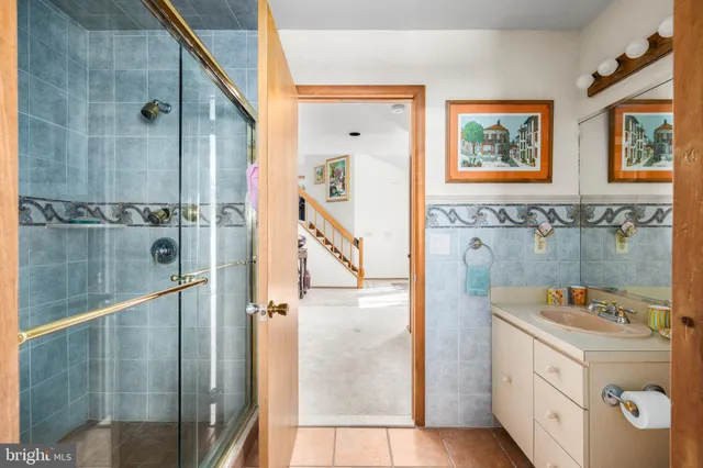 a bedroom with a large bed and a large window