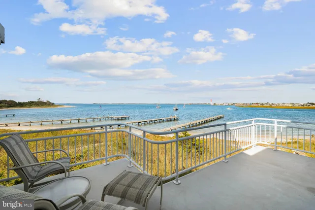 a living room with furniture a rug and a large window