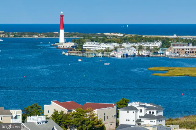 a view of a lake with houses in the back