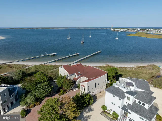 an aerial view of a house with a ocean view