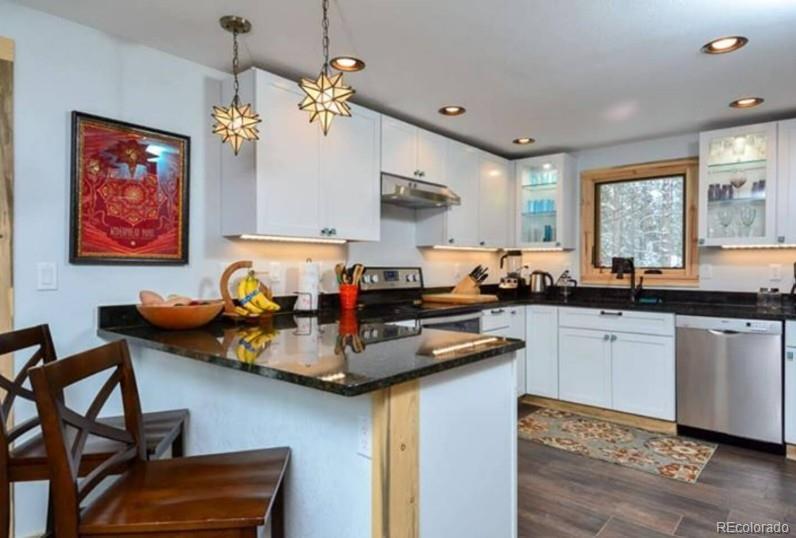 106 Protector Circle Breckenridge, CO 80424 - Photo 13 of 40 a kitchen with a sink cabinets and window
