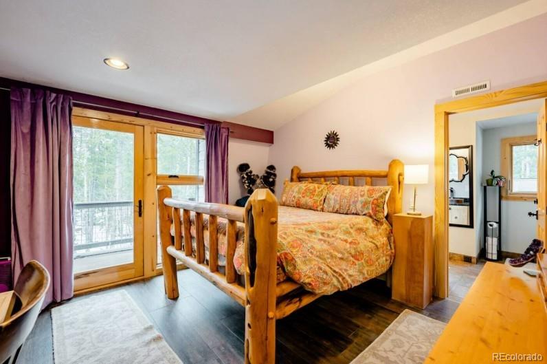 106 Protector Circle Breckenridge, CO 80424 - Photo 16 of 40 a bed room with a bed and a chair