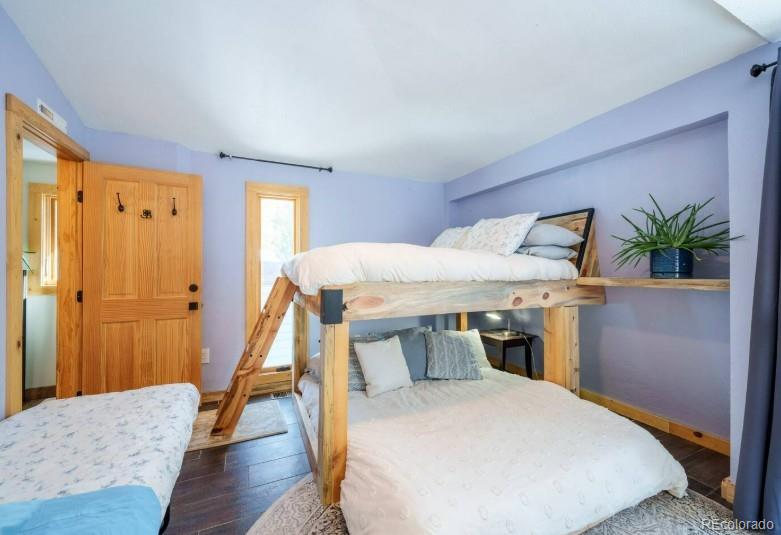 106 Protector Circle Breckenridge, CO 80424 - Photo 21 of 40 a bedroom with a bed and a table