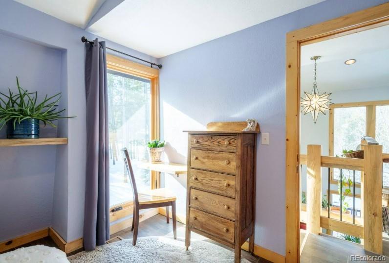 106 Protector Circle Breckenridge, CO 80424 - Photo 23 of 40 a view of a bedroom with a bed and a potted plant