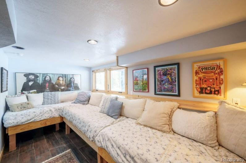 106 Protector Circle Breckenridge, CO 80424 - Photo 27 of 40 a living room with furniture and painting on the wall