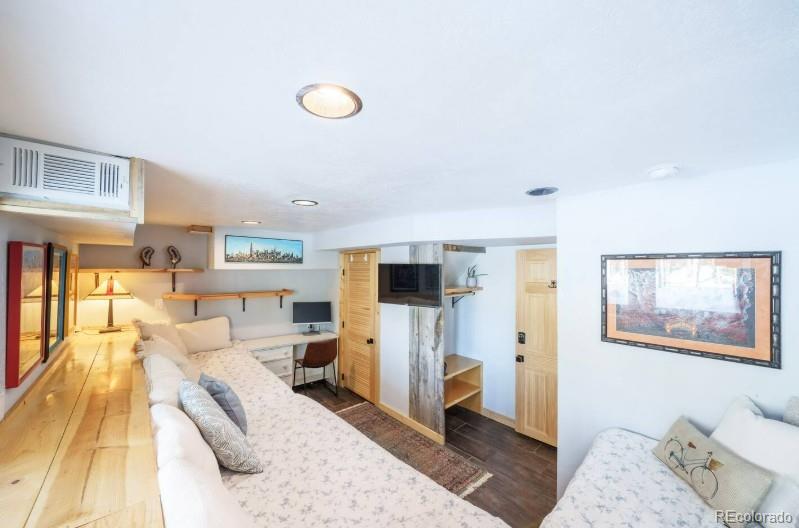 106 Protector Circle Breckenridge, CO 80424 - Photo 28 of 40 a living room with furniture and a flat screen tv