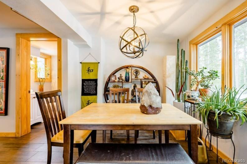 106 Protector Circle Breckenridge, CO 80424 - Photo 8 of 40 a view of a dining room with furniture window and wooden floor