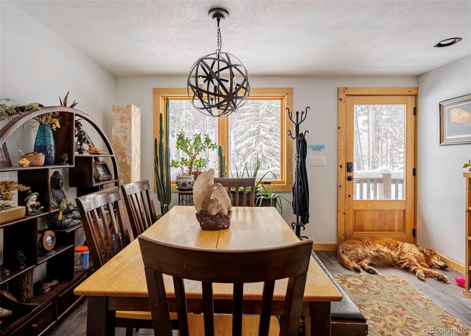 106 Protector Circle Breckenridge, CO 80424 - Photo 9 of 40 a view of a dining room with furniture window and wooden floor