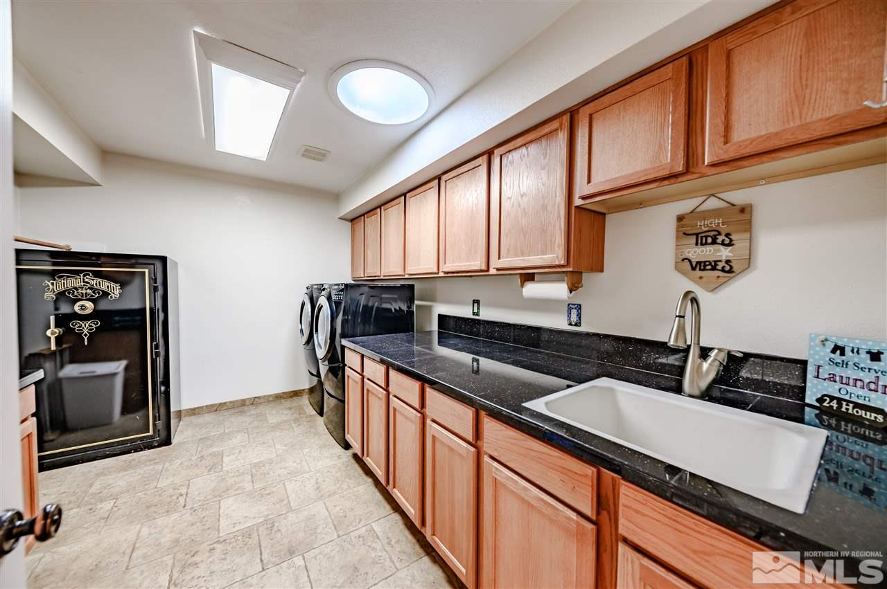 10300 Silva Ranch Road Reno, NV 89523 - Photo 12 of 25 a kitchen with granite countertop a sink and cabinets
