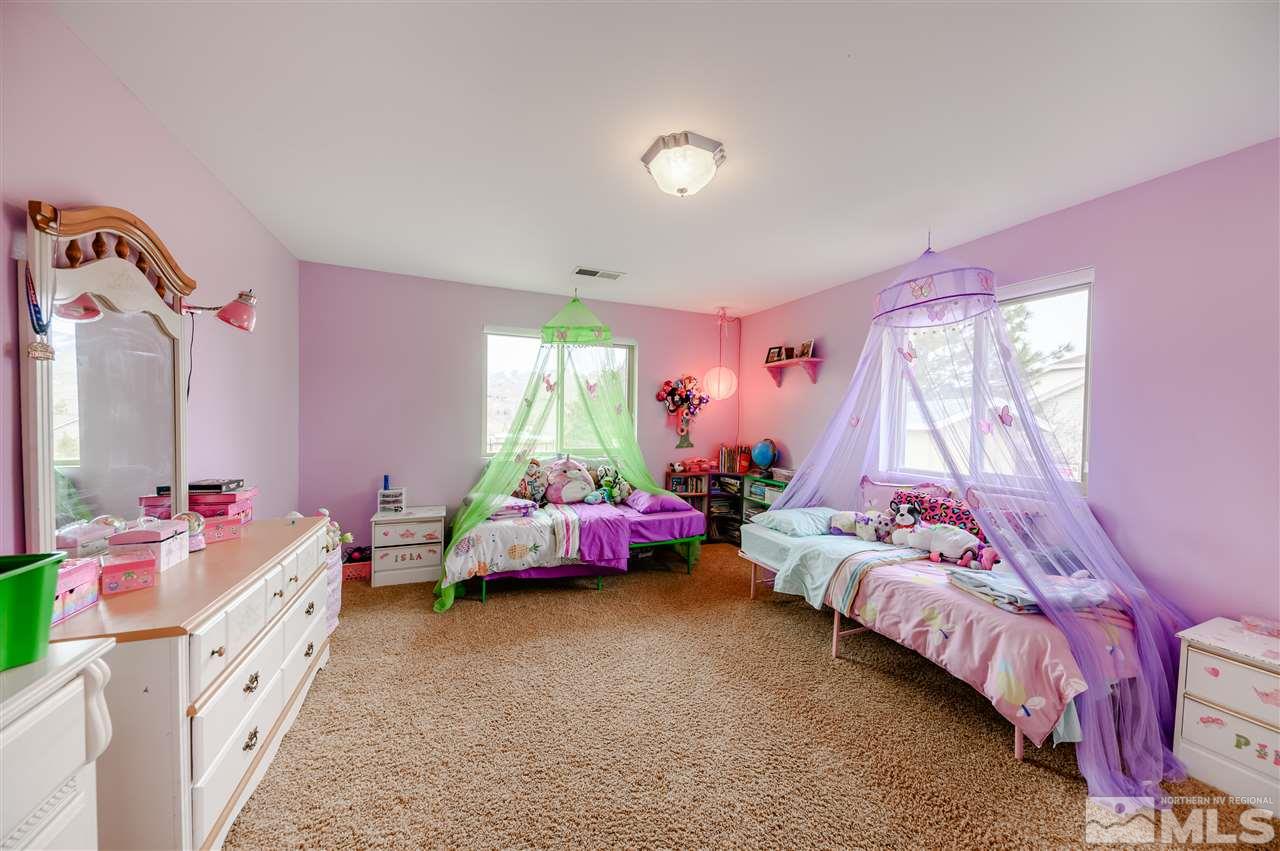 10300 Silva Ranch Road Reno, NV 89523 - Photo 15 of 25 a bed room with a bed and a window