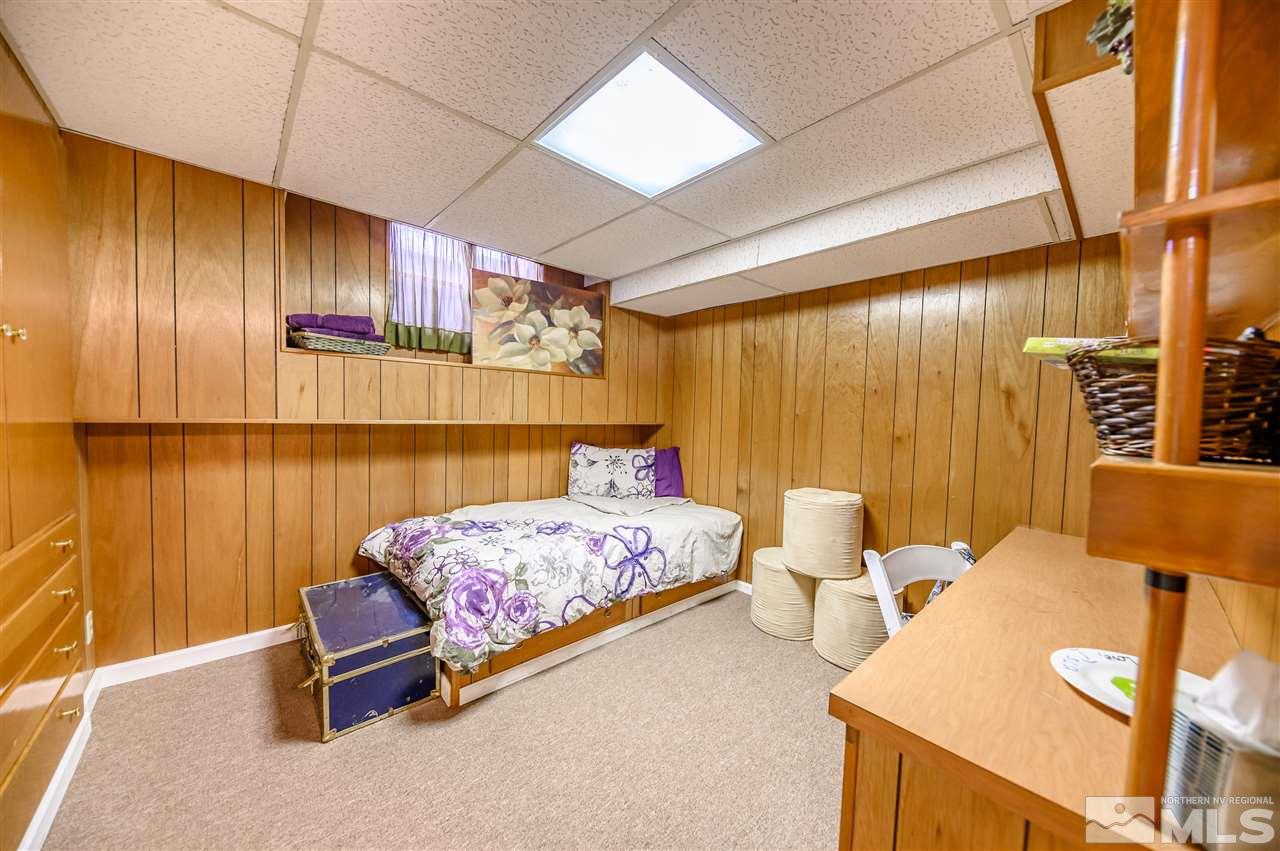 10300 Silva Ranch Road Reno, NV 89523 - Photo 19 of 25 a bedroom with a bed and wooden floor