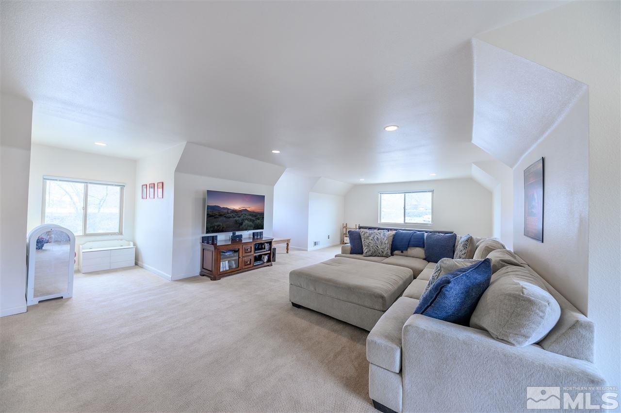 10300 Silva Ranch Road Reno, NV 89523 - Photo 21 of 25 a living room with furniture and a flat screen tv