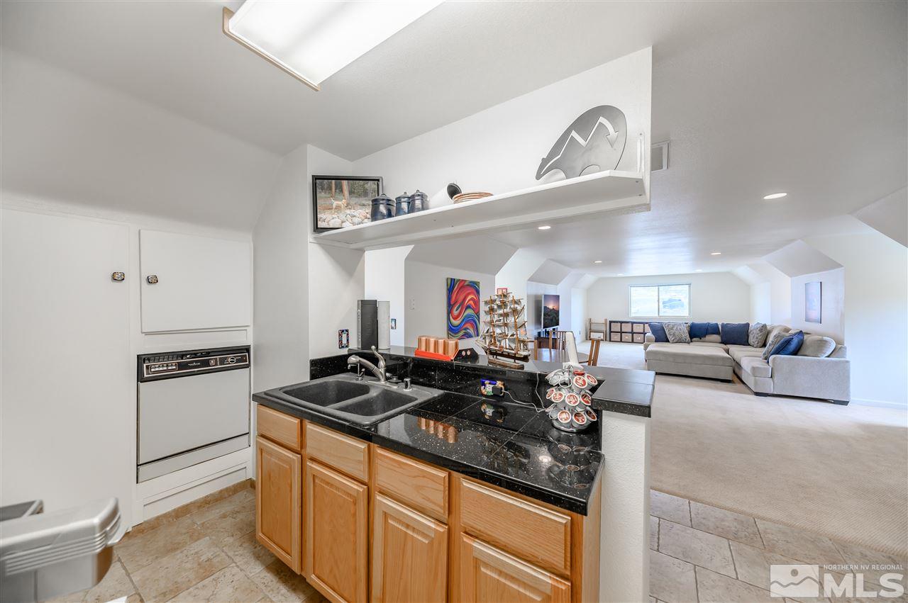 10300 Silva Ranch Road Reno, NV 89523 - Photo 22 of 25 a living room with furniture and a wooden floor