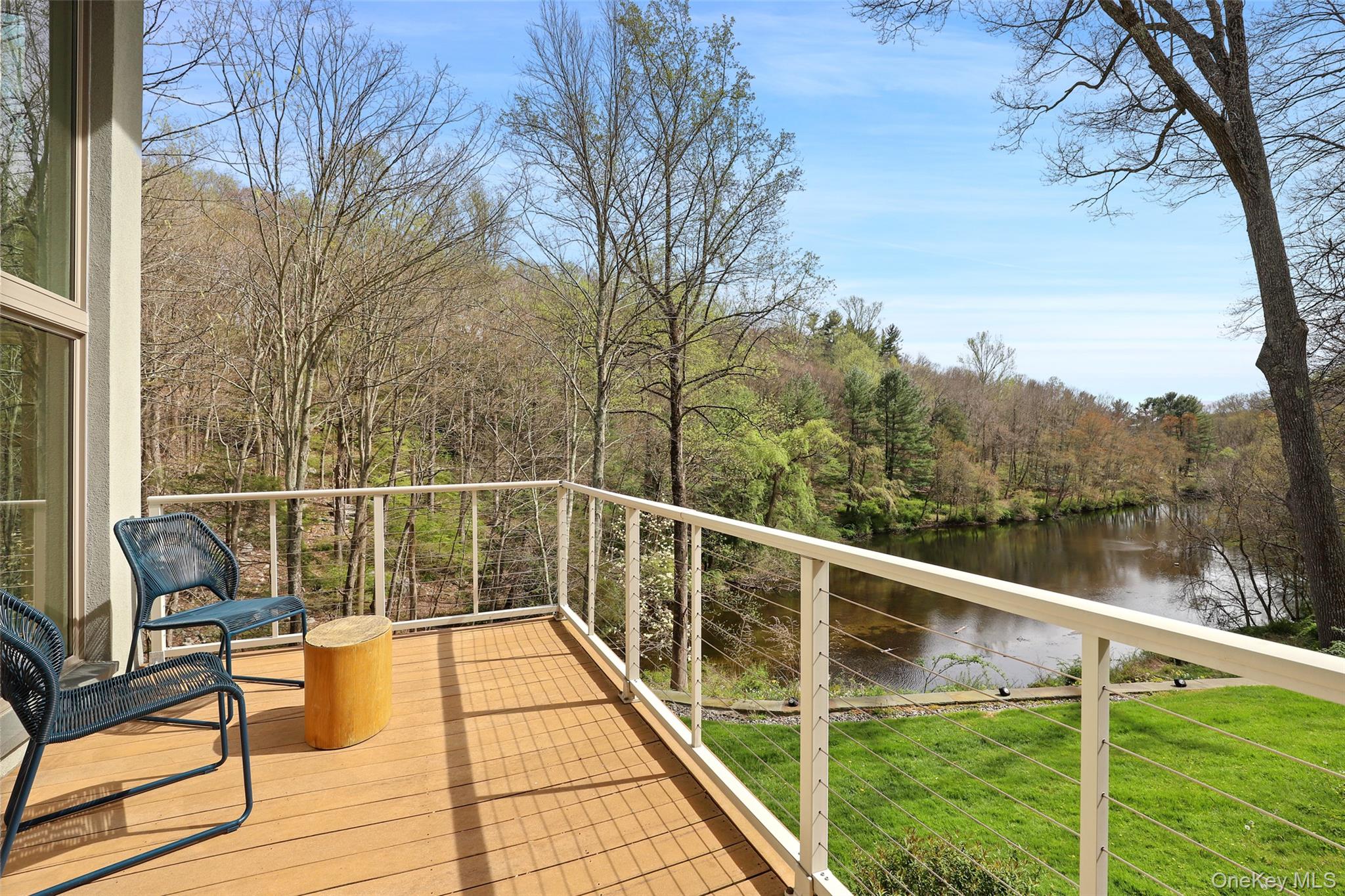 17 Fox Run Road Pound Ridge, NY 10576 - Photo 13 of 30 a view of a balcony with wooden floor and fence