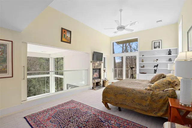 a bedroom with a large bed and a window